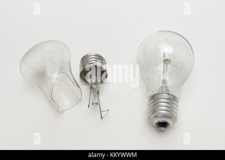 burned out bulb near the split in half incandescent lamp Stock Photo
