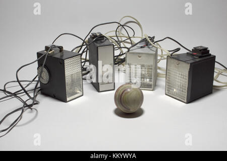 vintage electronic camera flashes, surrounding the ball of marble onyx ...