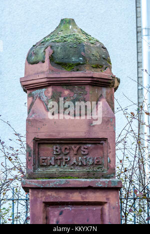 Relic of now demolished Victorian Couper Street primary school gate post with Boys Entrance carved in stone, Leith, Edinburgh, Scotland, UK Stock Photo