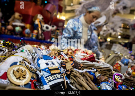 Saleswoman behind the counter at the New Year Fair in central Moscow store 'GUM', Russia Stock Photo
