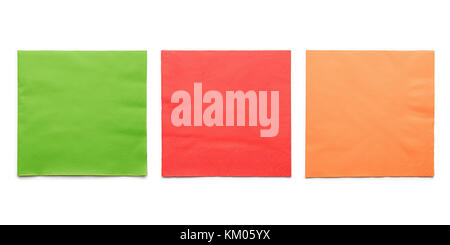 Green, red and orange colored paper napkins set. Isolated on white Stock Photo