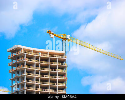 Vilnius, Lithuania - May 6, 2017: Development of modern building and the lifting crane Stock Photo