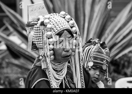 Akha hilltribe baby on mothers back, Doi Mae Salong, Chiang Rai, Thailand Stock Photo