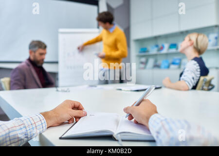 Taking Notes During Working Meeting Stock Photo