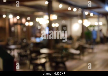 Vintage tone , Abstract blur  restaurant and cafe interior for background. Stock Photo