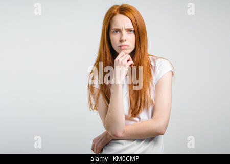 female with freckles and pursed lips having disappointed unhappy look Stock Photo