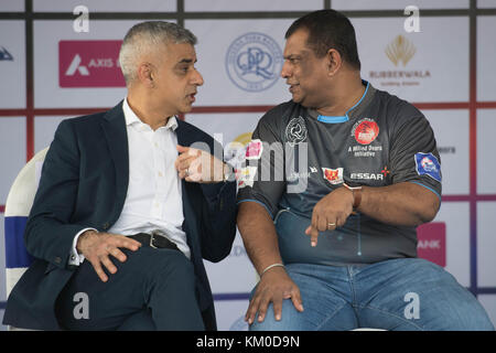 Mayor of London Sadiq Khan talking with Queen's Park Rangers owner, Tony Fernandes at the South Mumbai Junior Soccer Challenge in Mumbai, India which encourages young footballers of both sexes to take part in the sport. Stock Photo