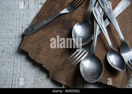 Detail of vintage cutlery on wooden table Stock Photo