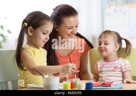 Teacher and pupils in the art workshop Stock Photo