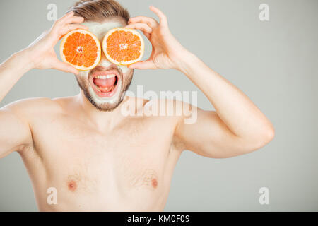 Facial mask from fresh fruits and clay for man concept Stock Photo