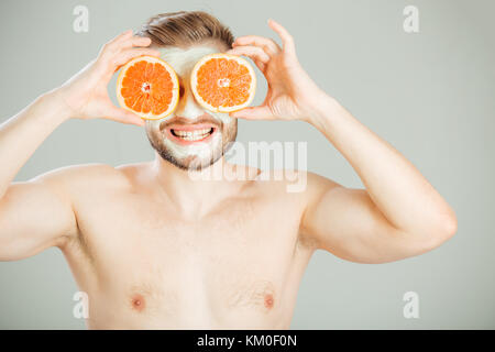 Facial mask from fresh fruits and clay for man concept Stock Photo