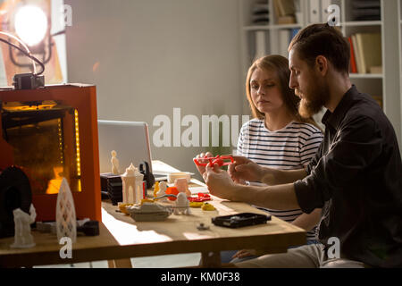 Designers Using 3D Printer in Studio Stock Photo