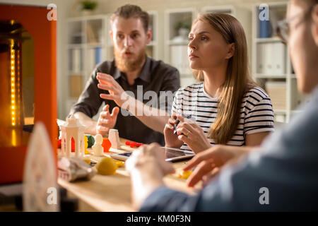 Architects Working with 3D Printer Stock Photo