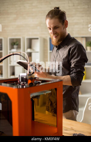 Bearded Designer Using 3D Printer Stock Photo