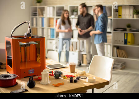 3D Printer on Table in Modern Design Studio Stock Photo