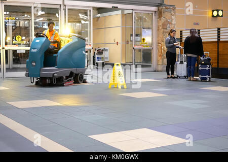 Vancouver, BC, Canada - October 13, 2017 : Motion of airport workers cleaning floor during night inside YVR airport in Vancouver BC Canada Stock Photo