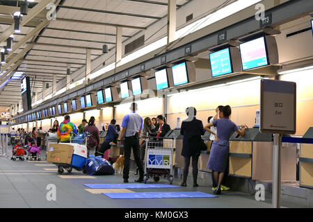 Vancouver, BC, Canada - October 13, 2017 : Motion of passengers with luggage at check in area inside YVR airport Stock Photo
