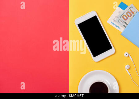 Smartphone cellphone with blank white screen on red yellow background. Stock Photo