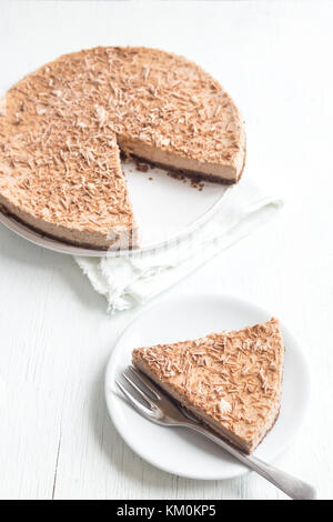 Chocolate cheesecake with mascarpone cheese on white background. Homemade chocolate cheese cake with copy space. Stock Photo