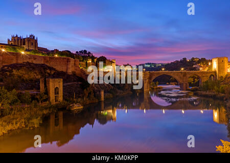 The Puente de San Martin in Toledo, Spain, before sunrise Stock Photo