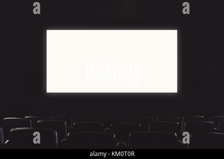 Empty cinema hall. White screen space for text Stock Photo