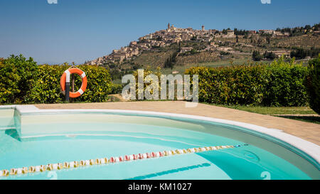 A view of the town of Trevi in Umbria (Central Italy) from a country house swimming pool (landscape format). 2017. Stock Photo