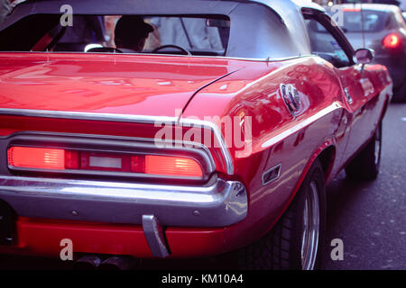 London, UK - A red classic American car in Brick Lane. Landscape format. Stock Photo