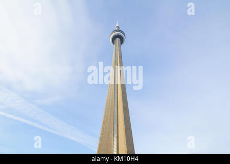 TORONTO, CANADA - DECEMBER 20,2016: View of the Canadian National Tower (CN Tower)  from its bottom during a sunny afternoon. It is one of the main la Stock Photo