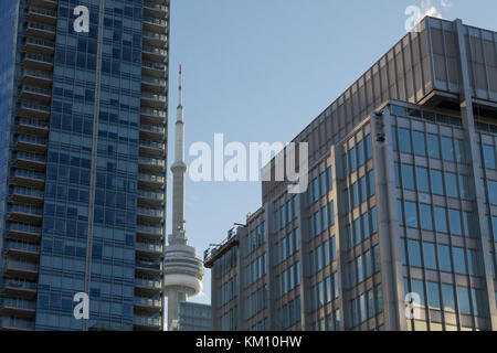 TORONTO, CANADA - DECEMBER 20, 2016: Canadian National Tower (CN Tower) surrounded by more modern buildings in downtown Toronto. CN Tower is the talle Stock Photo