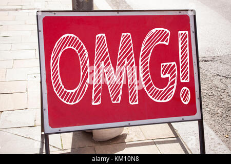 Conceptual hand writing text caption inspiration showing OMG Oh My God. Business concept for Surprise Humor written on announcement road sign with bac Stock Photo