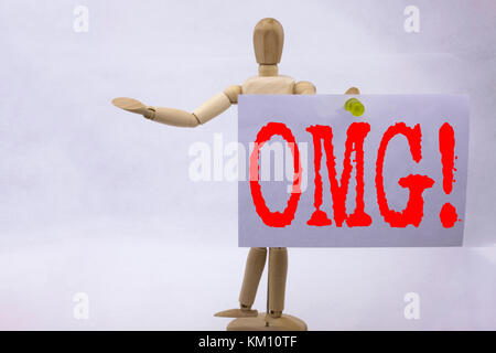 Conceptual hand writing text caption inspiration showing OMG Oh My God Business concept for Surprise Humor written on sticky note sculpture background Stock Photo
