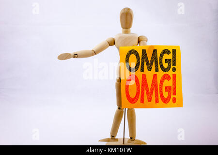 Conceptual hand writing text caption inspiration showing OMG Oh My God Business concept for Surprise Humor written on sticky note sculpture background Stock Photo