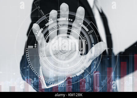 Businessman working on digital virtual interactive screen, with raising graph Stock Photo