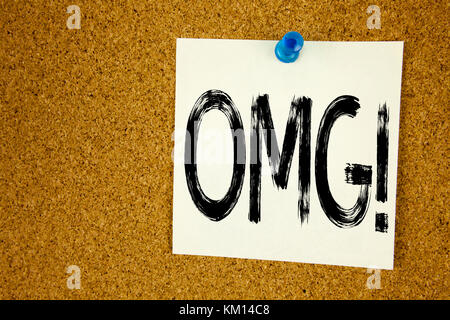 Conceptual hand writing text caption inspiration showing OMG Oh My God. Business concept for Surprise Humor written on sticky note, reminder cork back Stock Photo