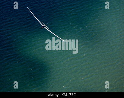 AJAXNETPHOTO. 24TH AUGUST, 2011. LEE-ON-THE-SOLENT, ENGLAND. - SEA BIRD - A PNGC GLIDER SWOOPS OVER A AN EMERALD SOLENT.  PHOTO;JONATHAN EASTLAND/AJAX REF:D2X 110209 1592 Stock Photo