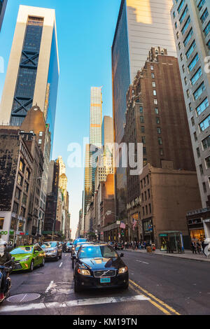 New York, USA - May 6, 2015: Intersection of Avenue of the Americas, or Sixth Avenue, and West 57th Street in Midtown Manhattan, NYC. 432 Park Avenue  Stock Photo
