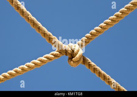 Old fishing boat rope against blue sky Stock Photo