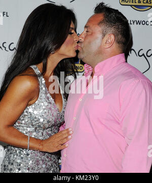 HOLLYWOOD, FL - AUGUST 10: Teresa Giudice and Joe Giudice host Absolutely Fabulous held at The Seminole Hard Rock Hotel and Casino.  'Real Housewives of New Jersey' couple Teresa and Giuseppe 'Joe' Giudice have been indicted on federal charges of bank and bankruptcy fraud, U.S. Attorney Paul J. Fishman announced. The Giudices were charged Monday in a 39-count indictment with conspiracy to commit mail and wire fraud, bank fraud, making false statements on loan applications and bankruptcy fraud, according to the indictment. The fraud was allegedly committed between September 2001 and September 2 Stock Photo