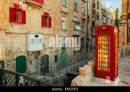 Red telephone box in Valletta, Malta. Stock Photo