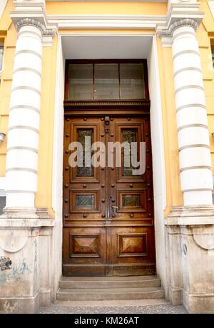 Old wooden door entrance in building in the old city of Rijeka Stock Photo