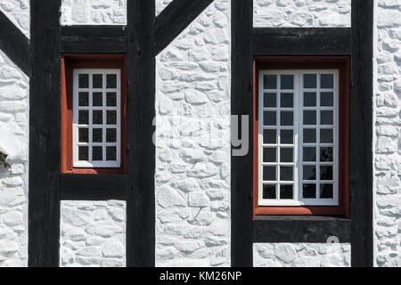 Two windows in a timber framed stone house at Fortress Louisbourg, Cape Breton, Nova Scotia, Canada. Stock Photo