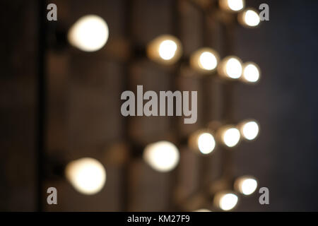 Old edison lamp mounted on wooden background Stock Photo