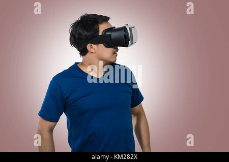 Asian Man wearing virtual reality on white background, include clipping path Stock Photo