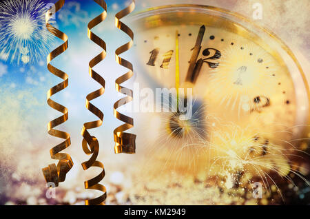 old clock at twelve o'cklock on holiday fireworks background - New Year's Stock Photo