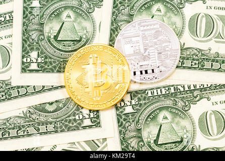 Physical version of Bitcoin on the american dollars. Business concept of worldwide cryptocurrency Stock Photo