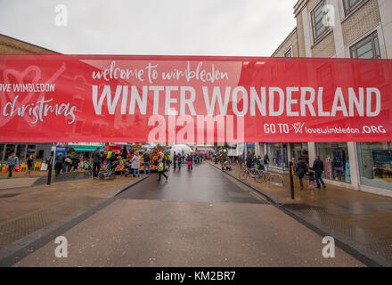 Wimbledon, London SW19, UK. 3 December, 2017. Love Wimbledon’s popular ‘Wimbledon Winter Wonderland’ returns to temporarily pedestrianised Wimbledon Broadway with thousands of visitors treated to Christmas market stalls, street entertainment, festive performances and children’s rides. Credit: Malcolm Park/Alamy Live News. Stock Photo