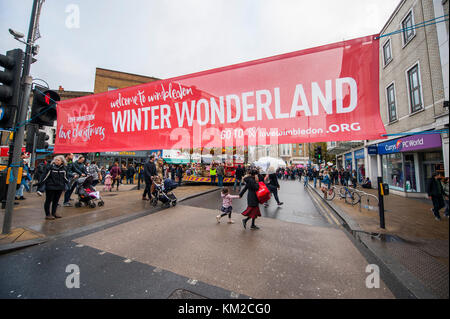 Wimbledon, London SW19, UK. 3 December, 2017. Love Wimbledon’s popular ‘Wimbledon Winter Wonderland’ returns to temporarily pedestrianised Wimbledon Broadway with thousands of visitors treated to Christmas market stalls, street entertainment, festive performances and children’s rides. Credit: Malcolm Park/Alamy Live News. Stock Photo