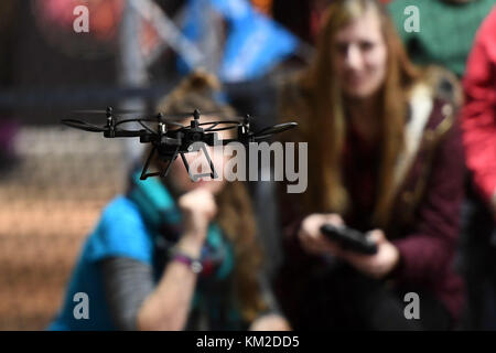 Berlin, Germany. 02nd Dec, 2017. Visitors trying out a drone during the Drone Champions League (DCL) in Berlin, Germany, 02 December 2017. Credit: Maurizio Gambarini/dpa/Alamy Live News Stock Photo