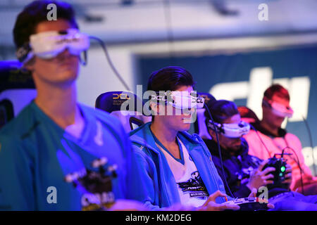 Berlin, Germany. 02nd Dec, 2017. Drone pilots controlling their drones as they race against each other in the track during the Drone Champions League (DCL) in Berlin, Germany, 02 December 2017. Credit: Maurizio Gambarini/dpa/Alamy Live News Stock Photo