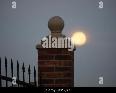 Sheernes, Kent, UK. 4th Dec, 2017. UK Weather: the supermoon setting over Sheerness this morning. Credit: James Bell/Alamy Live News Stock Photo